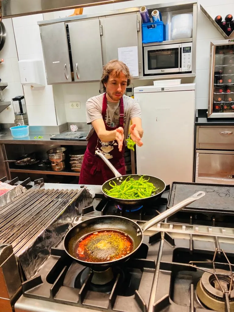 Eduard cooking at a gastronomical society